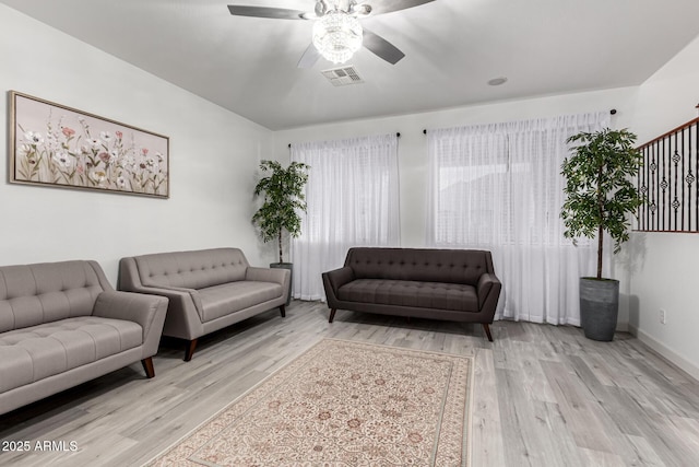 21472 E Saddle Ct, Queen Creek, AZ 85142 - living area featuring a ceiling fan, wood finished floors, and baseboards