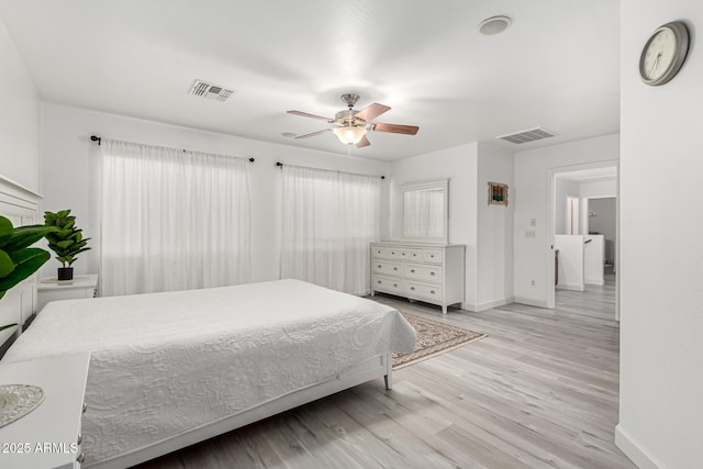21472 E Saddle Ct, Queen Creek, AZ 85142 - bedroom with baseboards, light wood-style flooring, and ceiling fan