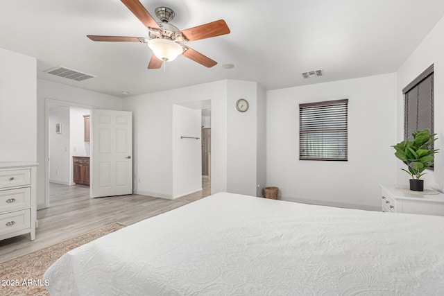 21472 E Saddle Ct, Queen Creek, AZ 85142 - bedroom with light wood-style flooring, baseboards, and ceiling fan