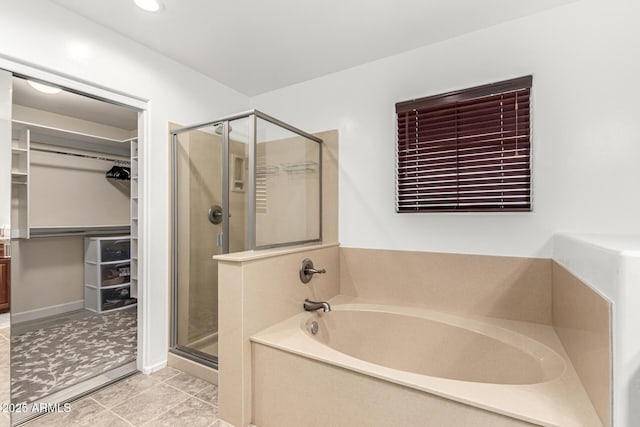 21472 E Saddle Ct, Queen Creek, AZ 85142 - bathroom with a stall shower, a walk in closet, a garden tub, tile patterned floors, and recessed lighting