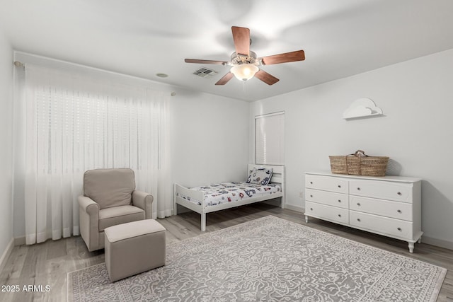 21472 E Saddle Ct, Queen Creek, AZ 85142 - bedroom with wood finished floors, baseboards, and ceiling fan