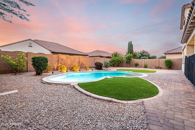21472 E Saddle Ct, Queen Creek, AZ 85142 - pool at dusk with a patio area and a fenced backyard