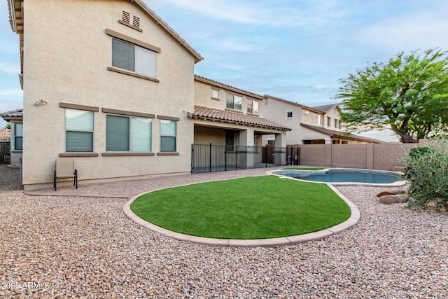 21472 E Saddle Ct, Queen Creek, AZ 85142 - rear view of property with stucco siding, a fenced backyard, a patio area, and a tiled roof