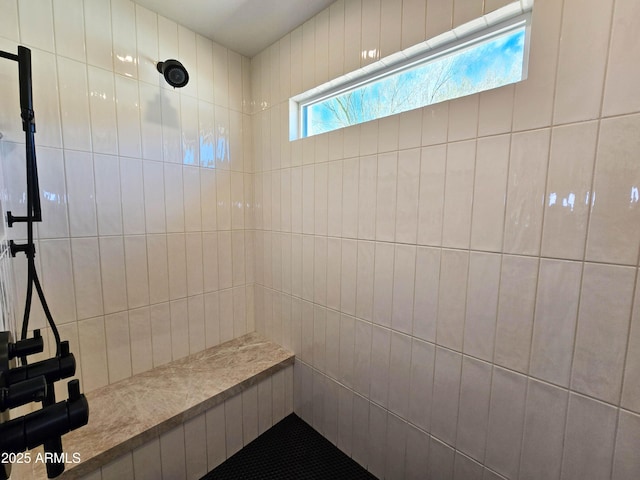 bathroom featuring tiled shower