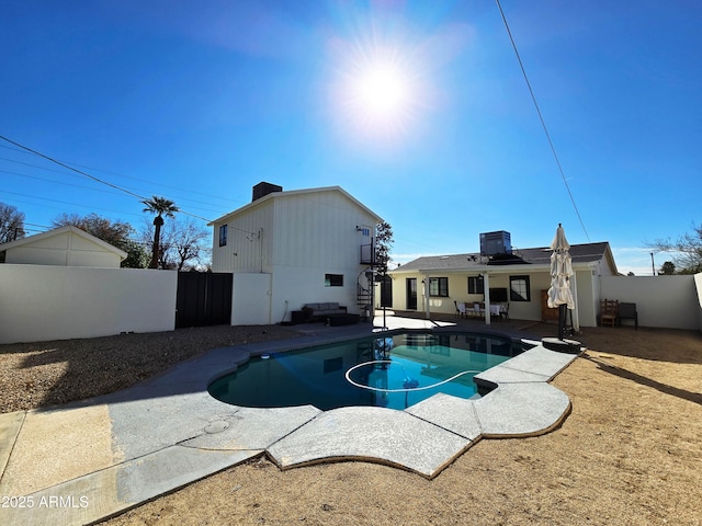 view of pool featuring a patio area, a fenced backyard, a fenced in pool, and cooling unit