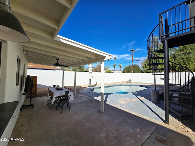 view of pool with a fenced backyard, stairway, a fenced in pool, and a patio