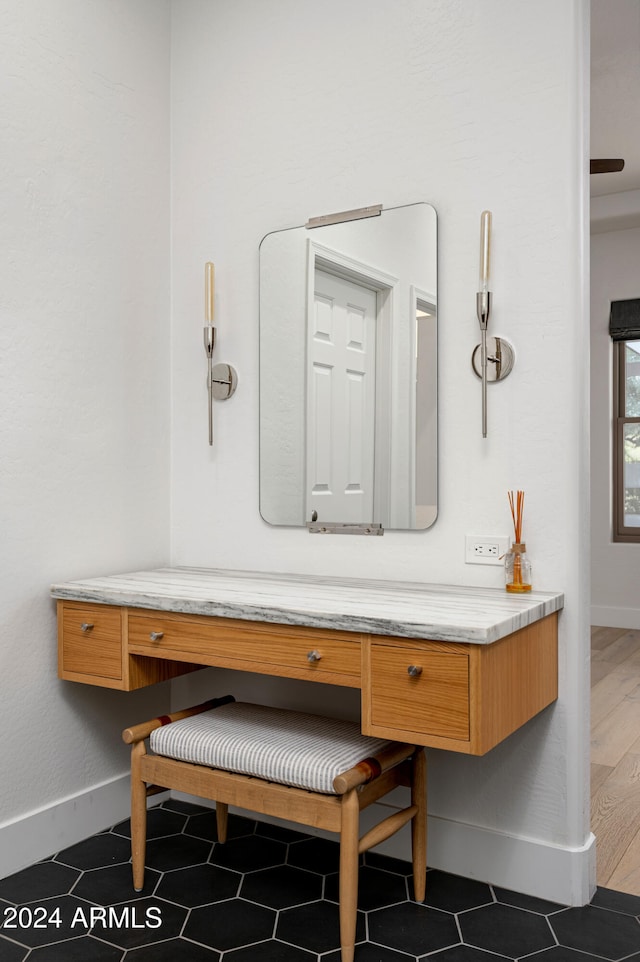 bathroom with hardwood / wood-style floors and vanity