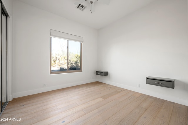 spare room with ceiling fan and light hardwood / wood-style floors