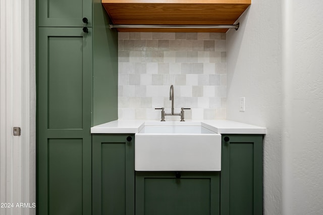 bathroom with vanity and tasteful backsplash