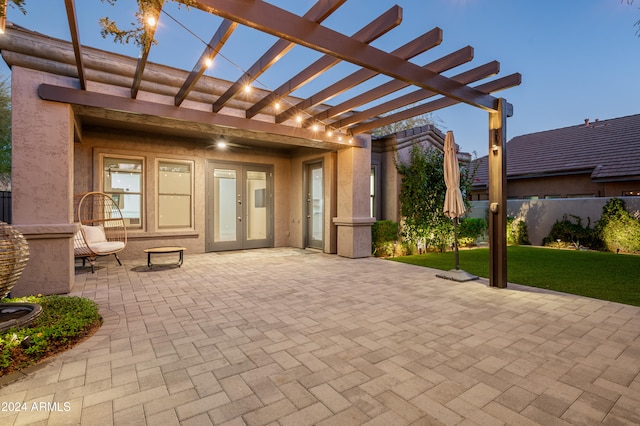 view of patio featuring a pergola and french doors