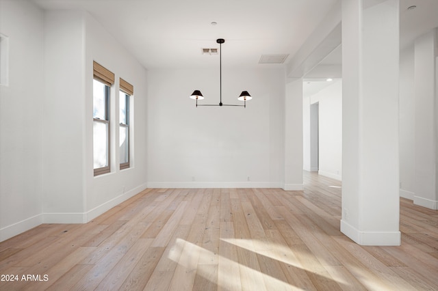 unfurnished dining area with light hardwood / wood-style floors