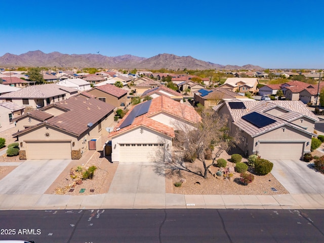 birds eye view of property with a mountain view and a residential view