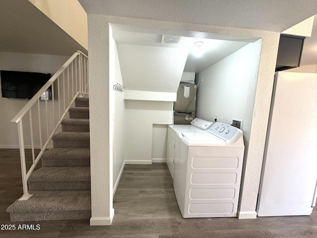 921 W University Dr Unit 1038, Mesa, AZ 85201 - laundry area with washer and dryer, wood finished floors, baseboards, and a textured wall