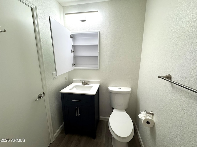 921 W University Dr Unit 1038, Mesa, AZ 85201 - half bath with wood finished floors, toilet, vanity, and baseboards