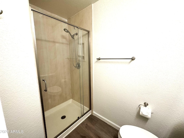 921 W University Dr Unit 1038, Mesa, AZ 85201 - bathroom with a stall shower, baseboards, wood finished floors, and toilet