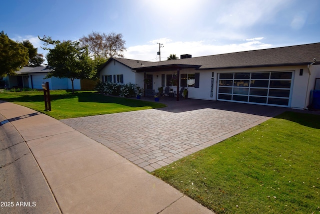 ranch-style home featuring a front yard and a garage