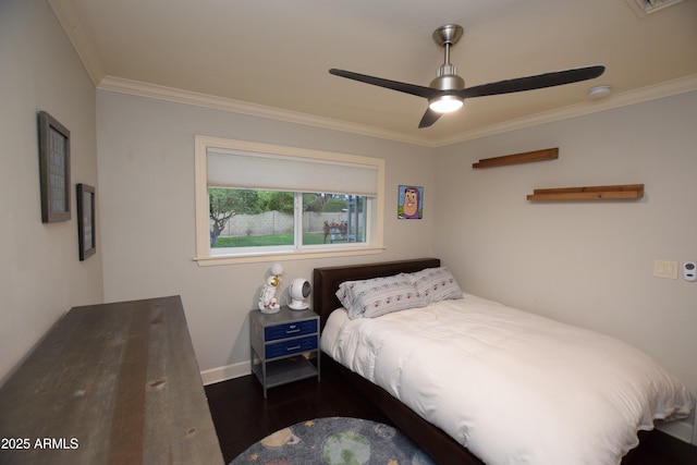 bedroom featuring ceiling fan, crown molding, and dark hardwood / wood-style flooring