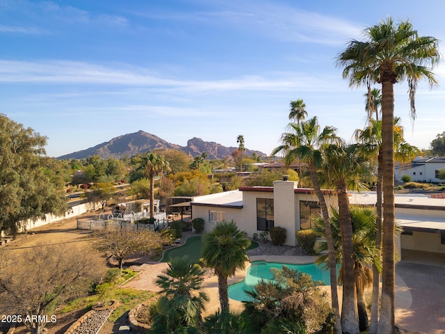 view of swimming pool featuring a mountain view