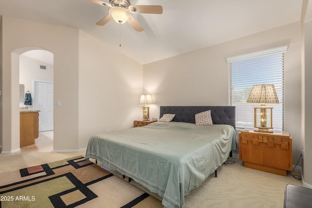 carpeted bedroom featuring ceiling fan and vaulted ceiling