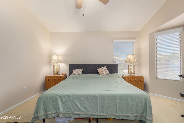 carpeted bedroom with multiple windows, vaulted ceiling, and ceiling fan