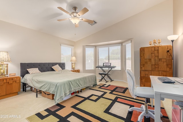 bedroom with lofted ceiling, light colored carpet, and ceiling fan