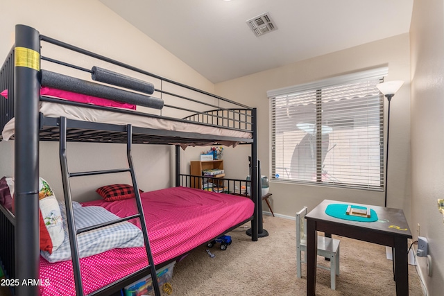 carpeted bedroom with lofted ceiling