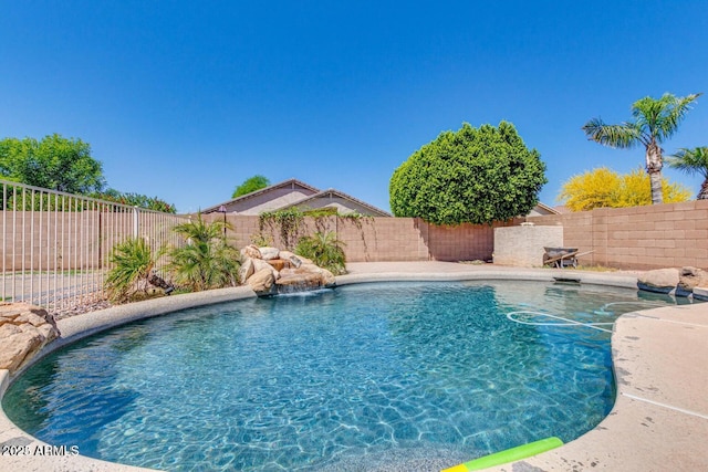 view of pool with pool water feature