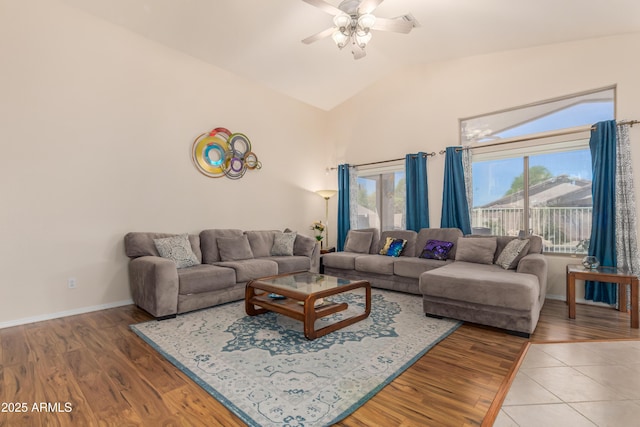 living room featuring ceiling fan, lofted ceiling, and hardwood / wood-style floors