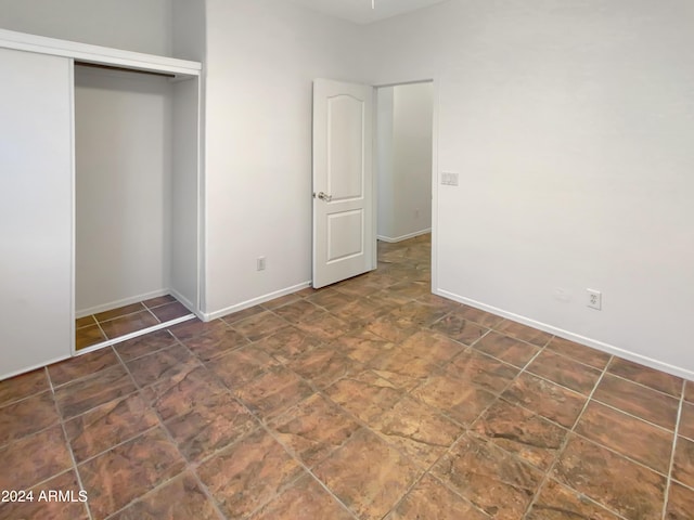 unfurnished bedroom with a closet