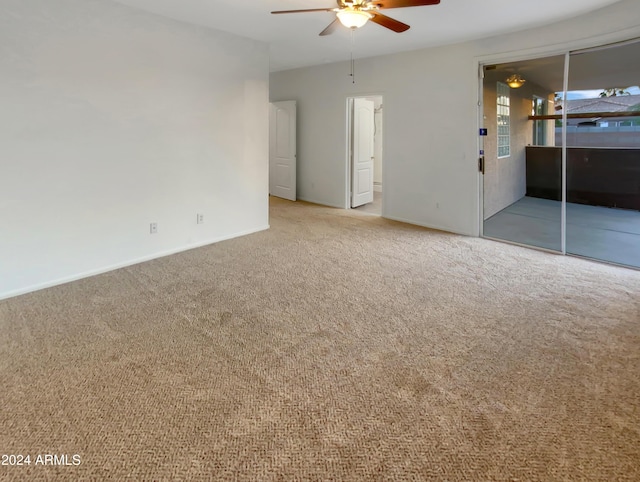 interior space featuring ceiling fan and light colored carpet