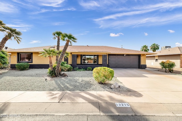 single story home featuring a garage