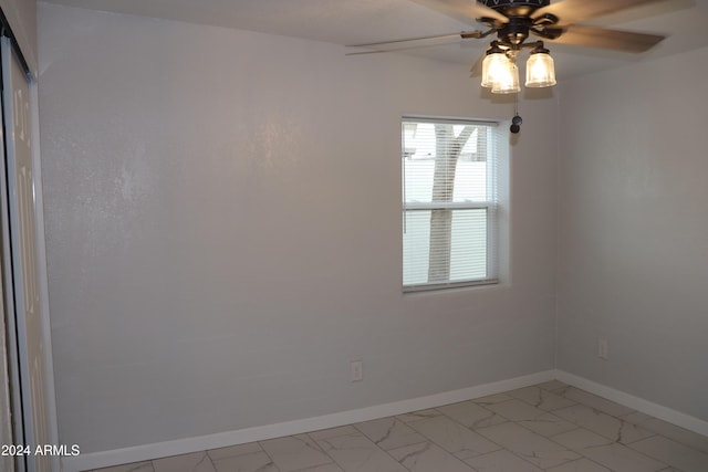 unfurnished room with ceiling fan