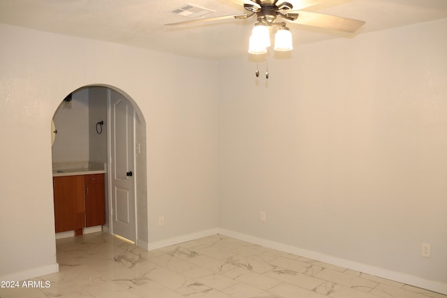 spare room with ceiling fan