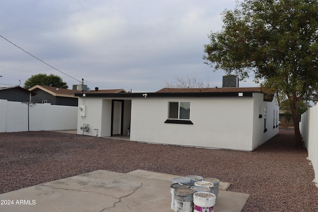 back of property with a patio area