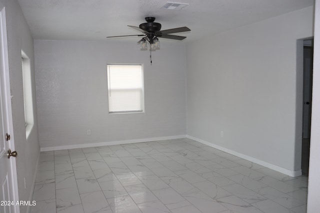 empty room featuring ceiling fan