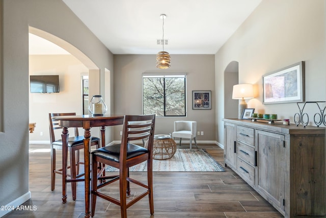 dining room with dark wood-type flooring