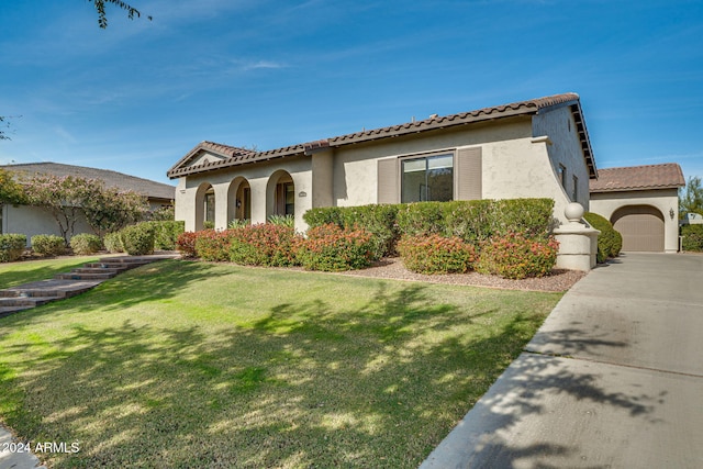 mediterranean / spanish-style house featuring a front lawn