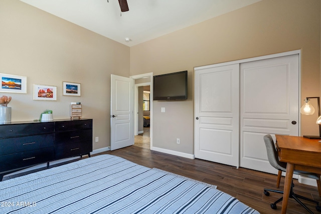 bedroom with dark hardwood / wood-style floors, a closet, and ceiling fan