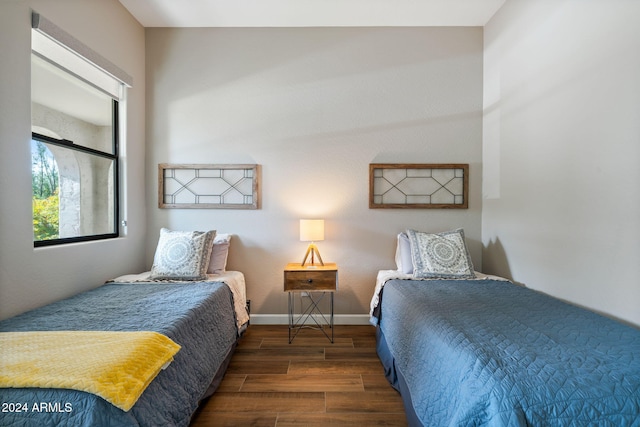 bedroom featuring dark wood-type flooring