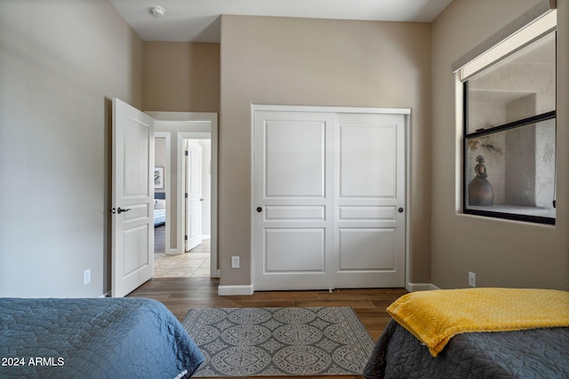 bedroom with a closet and wood-type flooring