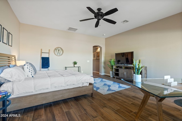 bedroom with dark hardwood / wood-style floors and ceiling fan