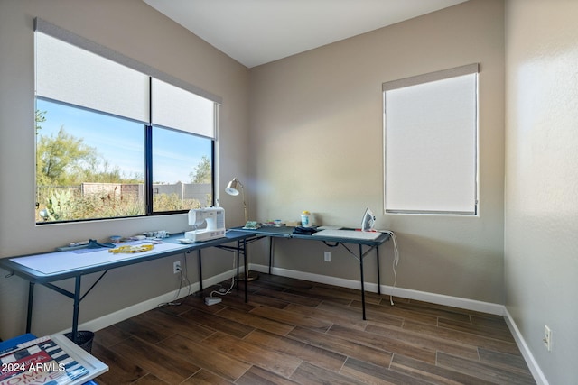 office space with dark wood-type flooring