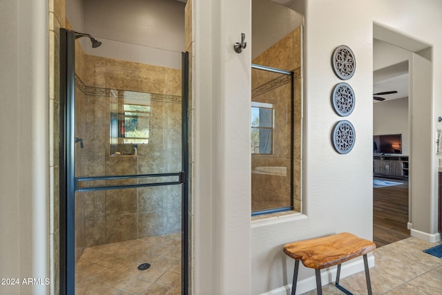 bathroom with wood-type flooring and a shower with door