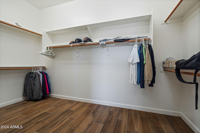 walk in closet featuring dark wood-type flooring