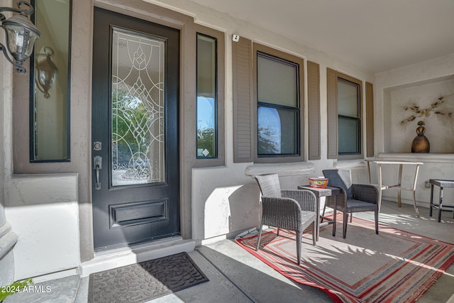 entrance to property featuring a porch