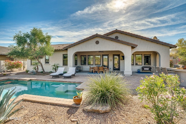 back of house with a patio area and ceiling fan