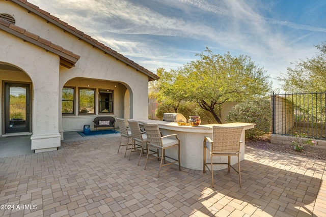 view of patio / terrace with exterior bar and grilling area