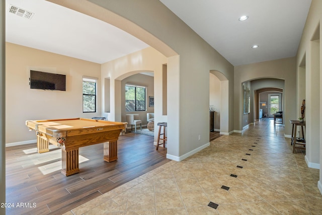 rec room with plenty of natural light, billiards, and light wood-type flooring