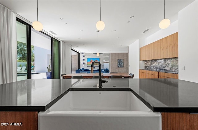 5301 N 43rd St, Phoenix, AZ 85018 - kitchen with modern cabinets, open floor plan, and pendant lighting