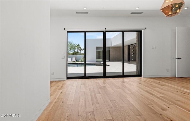 5301 N 43rd St, Phoenix, AZ 85018 - empty room featuring wood finished floors and recessed lighting